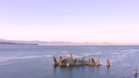 4K-Aerial-of-Tufa-Rocks-in-Mono-Lake,-at-sunset