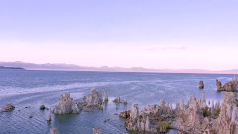 4K-Aerial-of-Tufa-Rocks-in-Mono-Lake,-at-sunset