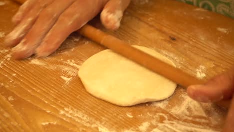Hands-kneading-the-dough-to-prepare-a-pie