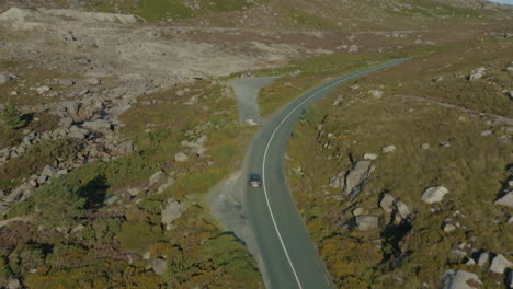 Aerial-4K,-cinematic-footage-of-a-car-driving-on-mountain-roads