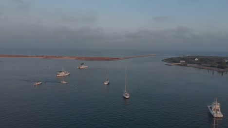 Aerial-view-of-beautiful-bay-with-boat-passing-by