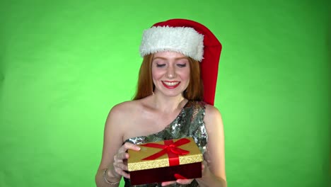 Pretty-Santa-girl-with-a-present-gift-over-chroma-key