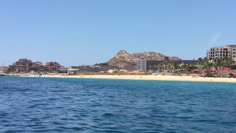View-of-the-Mexican-coastline-from-a-moving-boat,-Cabo-San-Lucas,-Mexico
