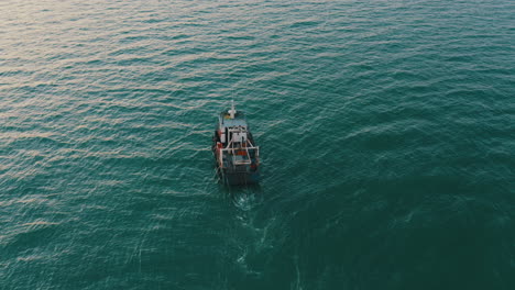 Aerial-4k-cinematic-,-fishing-boat-with-nets-in-the-water
