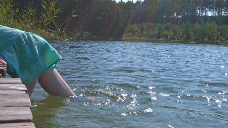 Bare-feet-in-water-lake