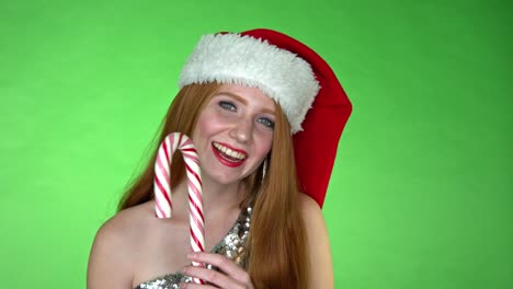 Glückliches-Lächelndes-Weihnachtsmädchen-Mit-Zuckerstangenlutscher