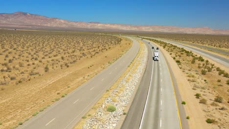 4K-aerial-of-a-highway-in-the-Mojave-Desert-,-California,-USA