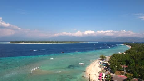 Aerial-view-rising-up-with-drone-of-tropical-islands,-gili-islands,-lombok,-bali,-indonesia