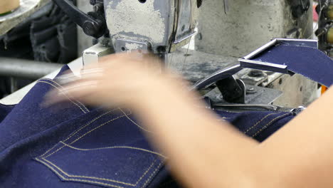 close-up-on-sewing-machine-working-in-industrial