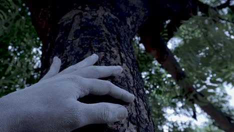 mysteries-hand-on-tree,-concept-of-demon-hand-on-tree-trying-to-follow-and-catch