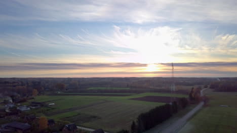 The-Sun-goes-down-in-the-countryside-aerial-view-with-telecommunication-tower-in-the-frame