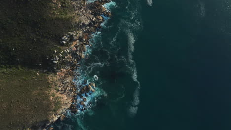 Aerial-Drone-Top-Down-of-Ocean-Waves-Crashing-against-Rocks