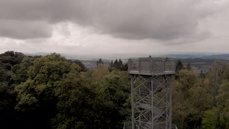Aerial-view-of-the-steel-construction-lookout-point-on-top-of-the-Wilzenberg-pilgrimage-mountain-revealing-the-Sauerland-landscape-in-Germany