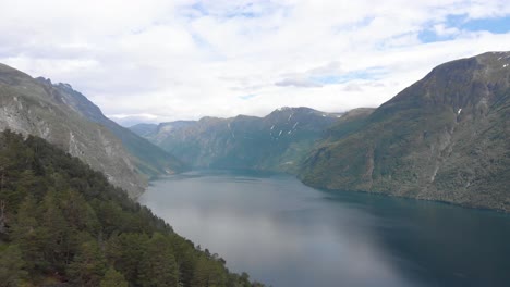 Aerial-view-of-a-norwegian-fjord,-Geiranger-moving-forward