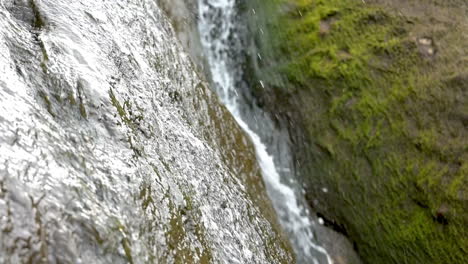 Zoom-in-on-waterfall-running-down-sandstone-rocks