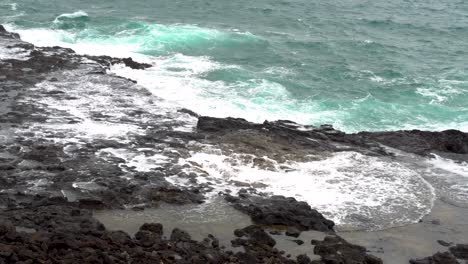 Water-from-Pacific-Ocean-shoots-out-of-blowhole-along-rocky-coast-of-Kaui