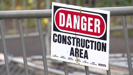 Danger-Construction-Area-sign-on-fence
