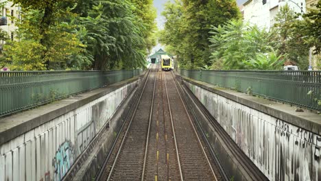 Modern-underground-train-of-Berlin-driving-out-of-tunnel-into-daylight