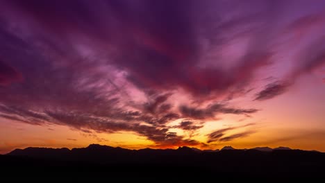 Sunset-motion-time-lapse-with-mountain-silhouettes-and-beautiful-purple-orange-colors,-movement-is-done-with-gimbal,-filmed-in-Ronda,-Malaga,-Spain-amazing-4k-footage
