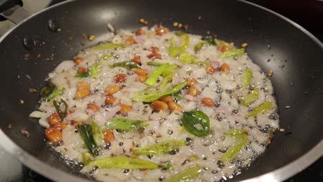 Frying-ingredients-or-veggies-in-frying-pan-in-hot-oil---Concept-showing-of-head-fry-or-Brain-fry