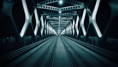 Night-reverse-flight-through-a-steel-tram-train-bridge