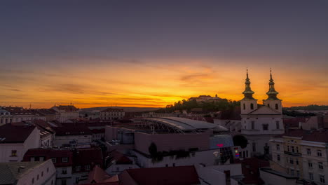 Castle-Spilberk-time-lapse-sun-goes-down-during-an-orange-sunset-in-side-of-castle-with-colorful-clouds-and-orange-sky-views-from-the-old-tower-to-hell-with-castle-in-Brno-Czech-4k-quality
