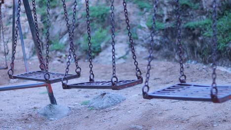concept-of-paranormal-activity,-video-of-one-of-the-Swing-swinging-by-itself-in-park