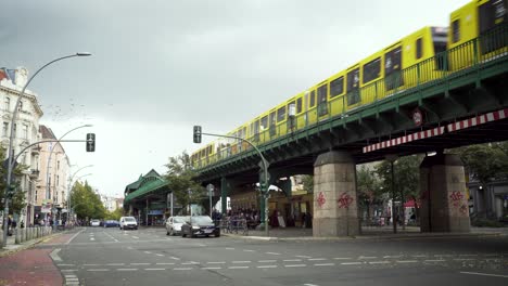 Modern-underground-train-of-Berlin-driving-in-daylight-next-to-swarm-of-birds