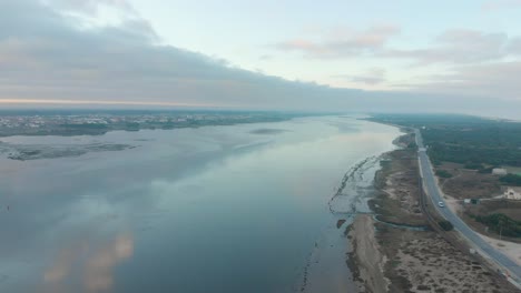 Aerial-view-during-sunrise-of-a-natural-reserve-and-it´s-river