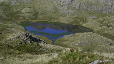 The-tiny-Tarn-at-Leaves-on-the-summit-of-Rosthwaite-Fell-on-a-hot-day
