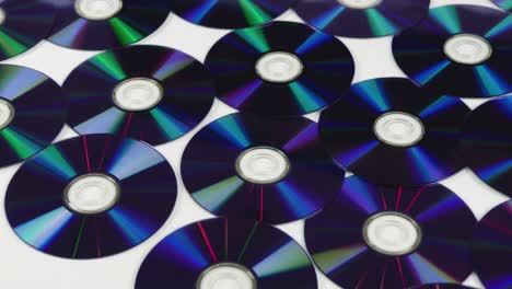 Blue-CDs-BlueRay-DVDs-isolated-on-a-white-background-pan-from-left-to-right
