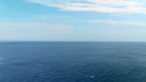 AERIAL:-Drone-descanding-above-the-Tyrrhenian-Sea-in-Scilla-,-Italy