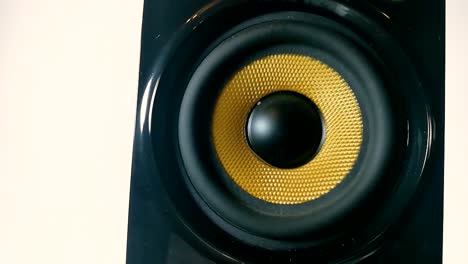 A-vibrating-membrane-on-Isolated-high-performance-black-and-golden-audio-speaker,-Part-2,-STILL
