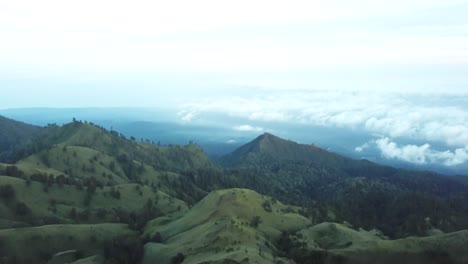 AERIAL-4K-Panning-Down-Shot-Volcanic-Highlands-of-Indonesia,-Mount-Rinjani