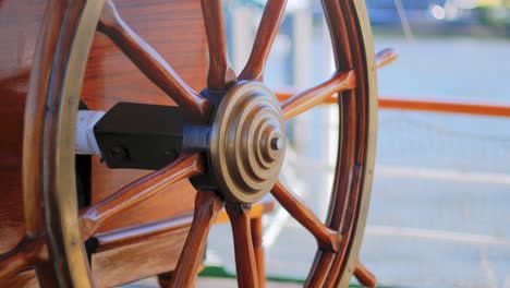 Close-up-of-an-old-wodden-ship's-steering-wheel-of-a-traditional-european-sailing-ship-Rickmer-Rickmers-from-the-19th-century