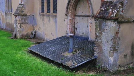 Tin-roof-to-cellar-attached-to-old-church-in-England