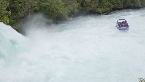 A-shot-of-people-floating-in-the-Huka-Falls-jet,-close-to-the-end-of-the-falls