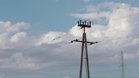 Two-birds-are-sitting-on-high-voltage-wires