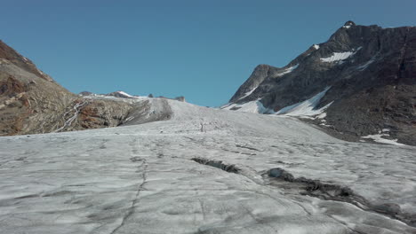 Low-angle-view-looking-up-mountain-slope-over-surface-of-glacier-in-Greenland