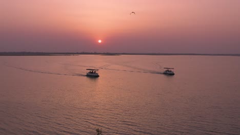 Tourist-Taking-Boat-Safari-at-Huge-Lake-at-Sunset