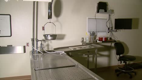 Empty-autopsy-table-in-medical-facility