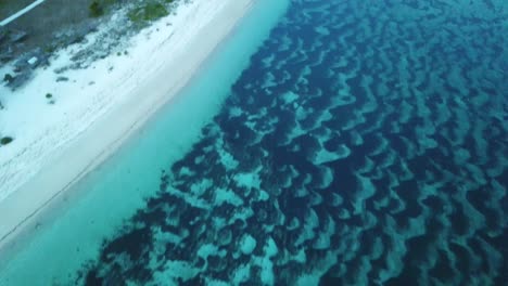 AERIAL-4K-Panning-Amazing-Blue-Waters-at-Isolated-Beach-in-Indonesia