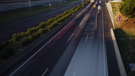 Motion-lapse-over-the-highway-of-the-traffic-entering-the-city-at-sunrise