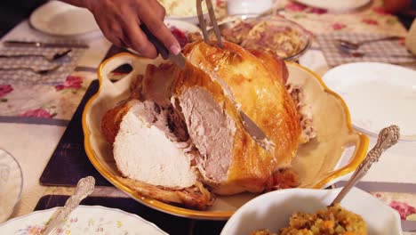 Thanksgiving-turkey-carving:-cutting-slices-of-tender-turkey-breast-meat-in-slow-motion-4K