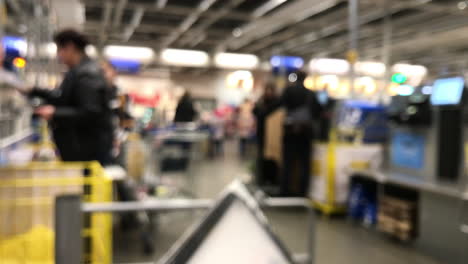 Blurred:-People-stand-at-self-service-workstations,-cash-in-the-store