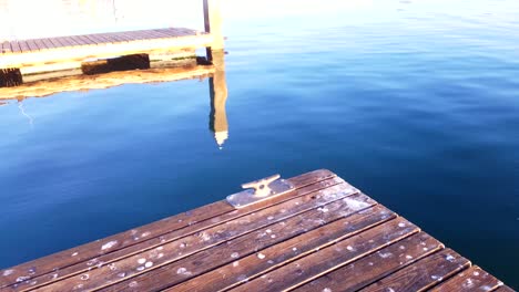 Sunrise-at-the-dock-as-the-water-slowly-ripples-by-the-bay