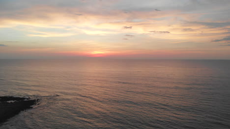 Calm-Sea-Under-The-Magnificent-Sunset-Sky-In-La-Union,-Philippines---Travel-Destinations---aerial