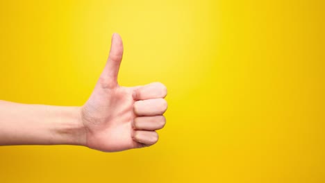 Woman-hand-show-thumbs-up-gesture