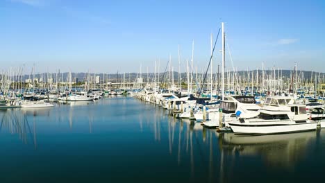 Beautiful-sailboats-at-the-marina-as-the-camera-slides-right-on-a-sunny-day
