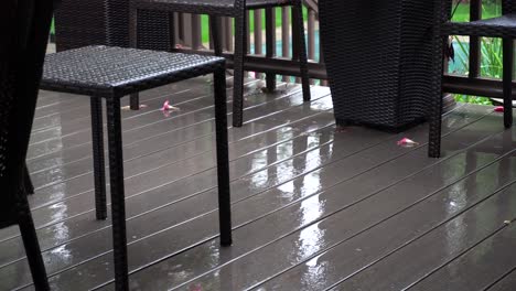 Light-rainfall-on-a-deck-during-a-light-summer-storm